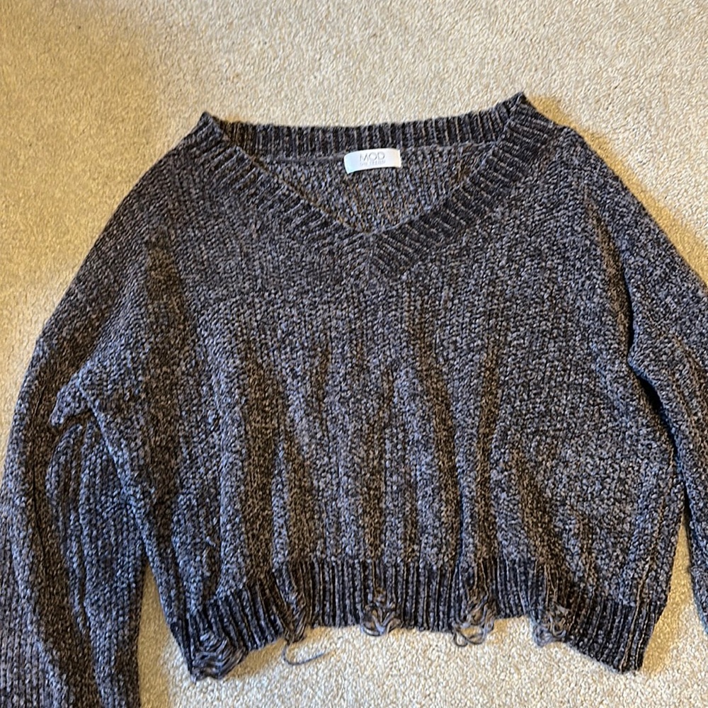 Distressed knitted sweater